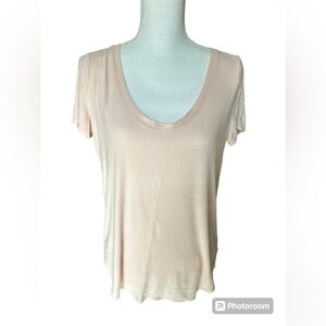 Pale pink Athleta ribbed short sleeve t-shirt with deep scoop front neckline.